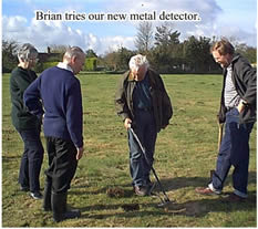 It was helpful to have several ears to locate the precise position of a find.  We later found it easier to spread polythene out on the ground when digging so that small finds did not disappear.